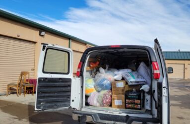A van with a lot of garbage in the back