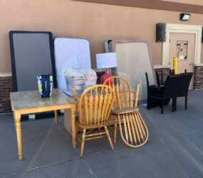 A table and chairs are outside on the patio.