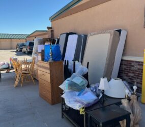 A bunch of furniture that are outside on the ground.