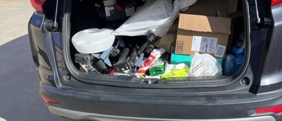 A car trunk with many items in it